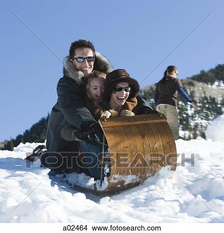 USA, Utah, Big Cottonwood Canyon, parents and daughter (8-9) tobogganing in mountains View Large Photo Image Picture - USA, Utah, Big Cottonwood Canyon, parents and daughter (8-9) tobogganing in mountains. Fotosearch