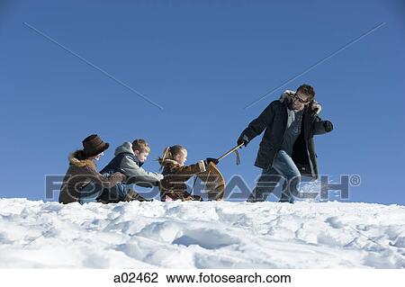 USA, Utah, Big Cottonwood Canyon, father pulling family on toboggan in mountains View Large Photo Image Stock Image - USA, Utah, Big Cottonwood Canyon, father pulling family on toboggan in mountains. Fotosearch