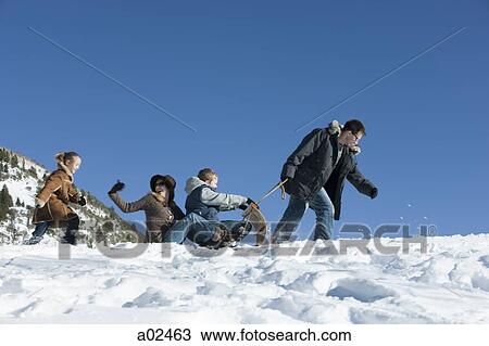 USA, Utah, Big Cottonwood Canyon, family tobogganing in mountains View Large Photo Image Stock Image - USA, Utah, Big Cottonwood Canyon, family tobogganing in mountains. Fotosearch