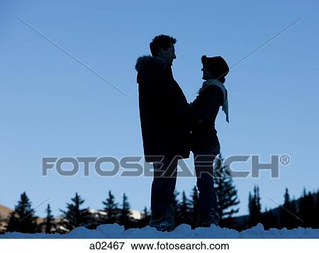 USA, Utah, Big Cottonwood Canyon, couple standing face to face in snow View Large Photo Image Stock Photo - USA, Utah, Big Cottonwood Canyon, couple standing face to face in snow. Fotosearch