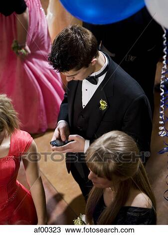 Stock Image - USA, Utah, Cedar Hills, Teenagers (14-17) at high school prom. Fotosearch