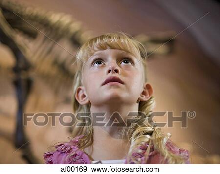 USA, Utah, Lehi, girl (6-7) looking up View Large Photo Image Stock Photo - USA, Utah, Lehi, girl (6-7) looking up. Fotosearch