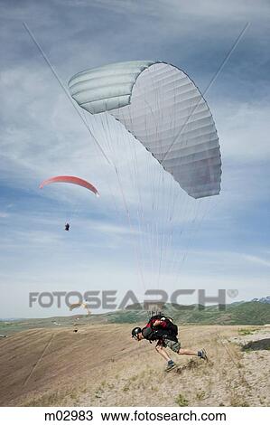 USA, Utah, Lehi, Mature male parachutist taking off, side view View Large Photo Image Stock Image - USA, Utah, Lehi, Mature male parachutist taking off, side view. Fotosearch