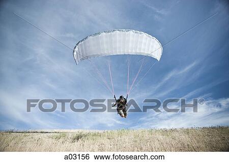 USA, Utah, Lehi, mature paraglider starting from hill View Large Photo Image Stock Photograph - USA, Utah, Lehi, mature paraglider starting from hill. Fotosearch