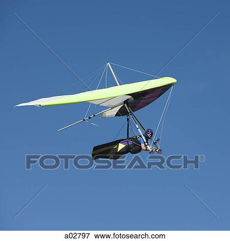 USA, Utah, Lehi, mid adult man hang gliding, low angle view View Large Photo Image Stock Photo - USA, Utah, Lehi, mid adult man hang gliding, low angle view. Fotosearch