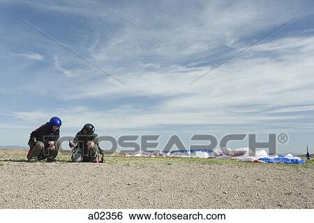 USA, Utah, Lehi, Two paragliders on ground View Large Photo Image Stock Photograph - USA, Utah, Lehi, Two paragliders on ground. Fotosearch