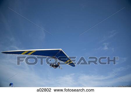 USA, Utah, Lehi, young man hang gliding, low angle view View Large Photo Image Stock Image - USA, Utah, Lehi, young man hang gliding, low angle view. Fotosearch