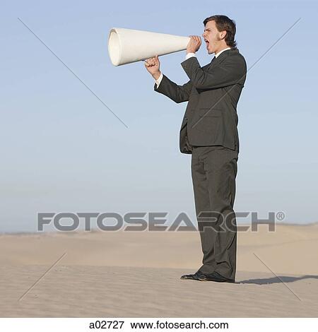 USA, Utah, Little Sahara, businessman shouting through loud speaker in desert View Large Photo Image Stock Photo - USA, Utah, Little Sahara, businessman shouting through loud speaker in desert. Fotosearch