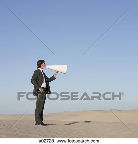 USA, Utah, Little Sahara, businessman shouting through loud speaker in desert View Large Photo Image Stock Photo - USA, Utah, Little Sahara, businessman shouting through loud speaker in desert. Fotosearch