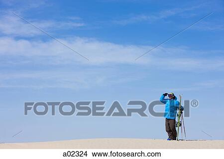 USA, Utah, Little Sahara, man with skiwear standing in desert View Large Photo Image Picture - USA, Utah, Little Sahara, man with skiwear standing in desert. Fotosearch