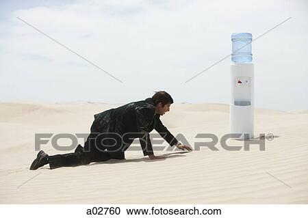 USA, Utah, Little Sahara, mid adult businessman crawling to water cooler on desert View Large Photo Image Stock Image - USA, Utah, Little Sahara, mid adult businessman crawling to water cooler on desert. Fotosearch