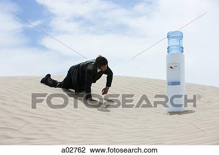 USA, Utah, Little Sahara, mid adult businessman crawling to water cooler on desert View Large Photo Image Stock Image - USA, Utah, Little Sahara, mid adult businessman crawling to water cooler on desert. Fotosearch