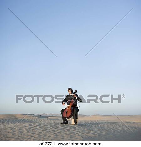 USA, Utah, Little Sahara, young man with cello in desert View Large Photo Image Stock Image - USA, Utah, Little Sahara, young man with cello in desert. Fotosearch