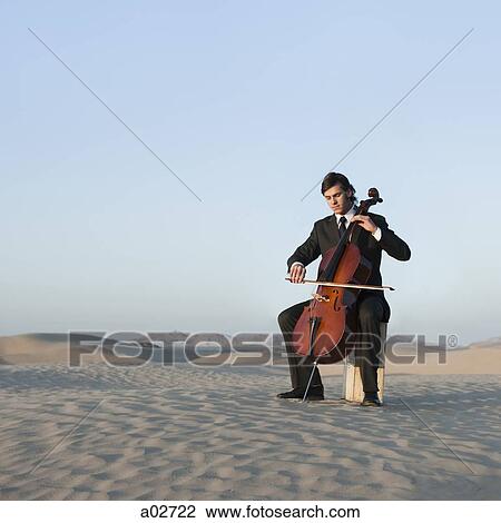 USA, Utah, Little Sahara, young man with cello in desert View Large Photo Image Stock Image - USA, Utah, Little Sahara, young man with cello in desert. Fotosearch
