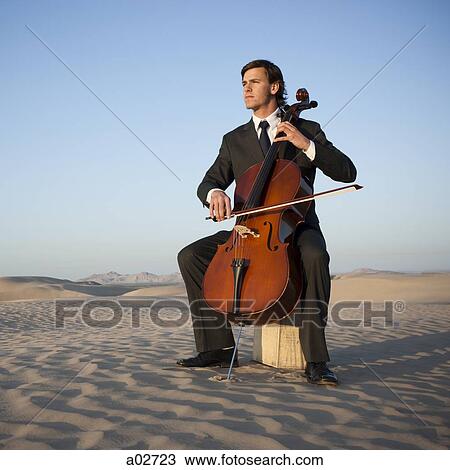 USA, Utah, Little Sahara, young man with cello in desert View Large Photo Image Stock Image - USA, Utah, Little Sahara, young man with cello in desert. Fotosearch