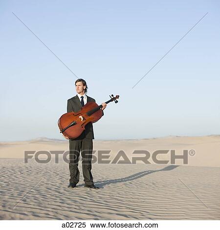 USA, Utah, Little Sahara, young man with cello in desert View Large Photo Image Stock Photography - USA, Utah, Little Sahara, young man with cello in desert. Fotosearch