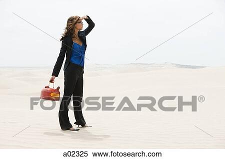 USA, Utah, Little Sahara, young woman holding kettle in desert View Large Photo Image Stock Photography - USA, Utah, Little Sahara, young woman holding kettle in desert. Fotosearch