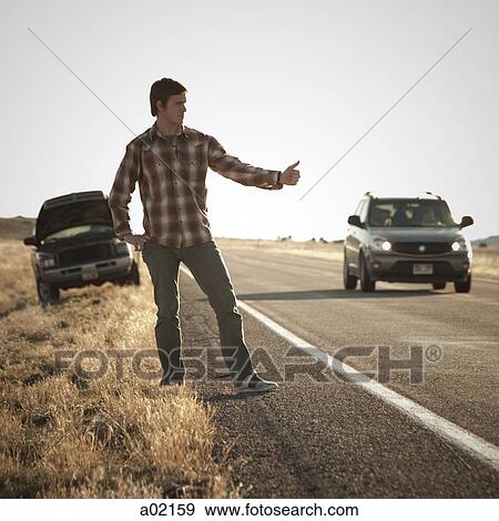 USA, Utah, man hailing on roadside, broken car in background View Large Photo Image Stock Photo - USA, Utah, man hailing on roadside, broken car in background. Fotosearch