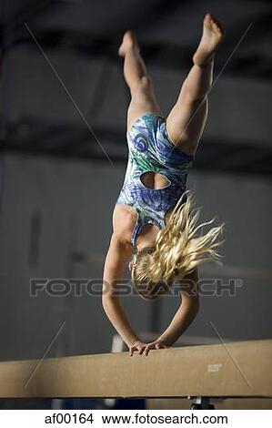 Picture - USA, Utah, Orem, girl (10-11) exercising on balance beam. Fotosearch
