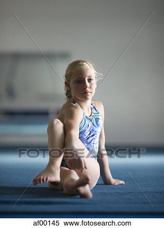 USA, Utah, Orem, Girl (10-11) stretching in gym View Large Photo Image Stock Photography - USA, Utah, Orem, Girl (10-11) stretching in gym. Fotosearch