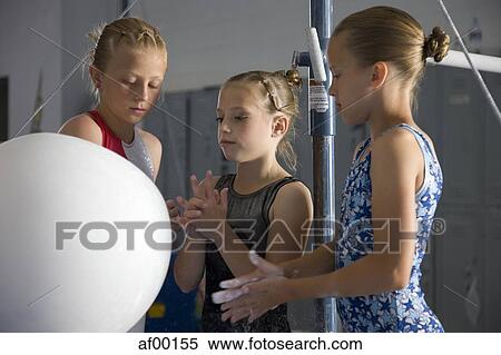 USA, Utah, Orem, girls (8-11) in gym applying talcum powder to hands View Large Photo Image Stock Photography - USA, Utah, Orem, girls (8-11) in gym applying talcum powder to hands. Fotosearch