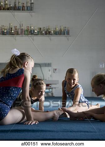 USA, Utah, Orem, girls (8-11) exercising in gym View Large Photo Image Stock Image - USA, Utah, Orem, girls (8-11) exercising in gym. Fotosearch