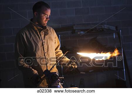 USA, Utah, Orem, male welder using blowtorch in workshop View Large Photo Image Stock Photo - USA, Utah, Orem, male welder using blowtorch in workshop. Fotosearch