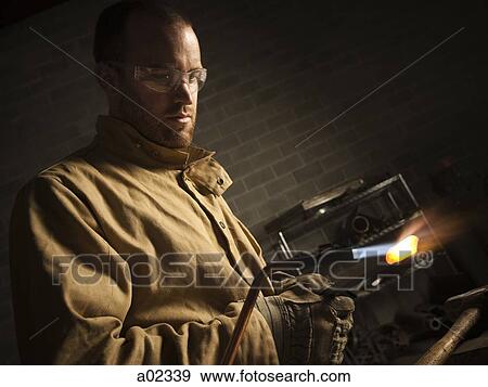 USA, Utah, Orem, male welder using blowtorch in workshop View Large Photo Image Stock Photo - USA, Utah, Orem, male welder using blowtorch in workshop. Fotosearch