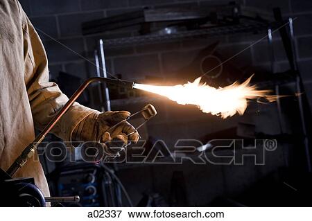 USA, Utah, Orem, male welder with blowtorch in workshop View Large Photo Image Stock Photo - USA, Utah, Orem, male welder with blowtorch in workshop. Fotosearch