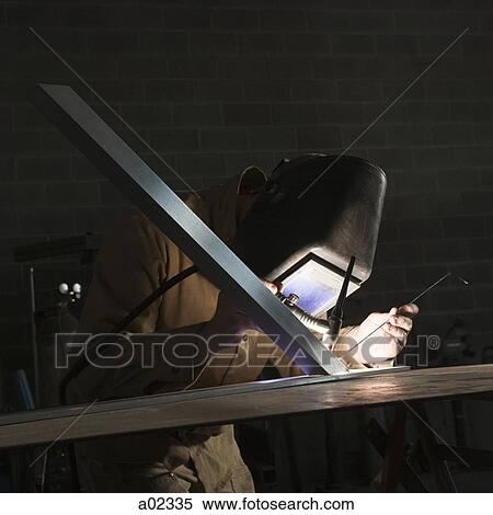USA, Utah, Orem, man soldering metal in workshop View Large Photo Image Stock Photography - USA, Utah, Orem, man soldering metal in workshop. Fotosearch