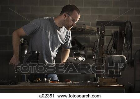 USA, Utah, Orem, man using machine in workshop View Large Photo Image Stock Image - USA, Utah, Orem, man using machine in workshop. Fotosearch