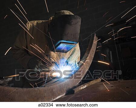 USA, Utah, Orem, man welding metal in workshop View Large Photo Image Picture - USA, Utah, Orem, man welding metal in workshop. Fotosearch
