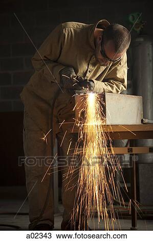 USA, Utah, Orem, man welding metal in workshop View Large Photo Image Stock Image - USA, Utah, Orem, man welding metal in workshop. Fotosearch
