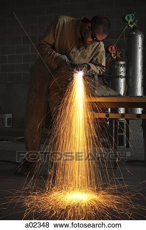 USA, Utah, Orem, man welding metal in workshop View Large Photo Image Stock Photo - USA, Utah, Orem, man welding metal in workshop. Fotosearch
