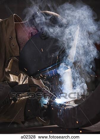 USA, Utah, Orem, man welding metal View Large Photo Image Stock Photo - USA, Utah, Orem, man welding metal. Fotosearch