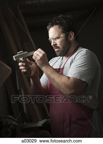 USA, Utah, Orem, mid adult carpenter working View Large Photo Image Stock Photo - USA, Utah, Orem, mid adult carpenter working. Fotosearch