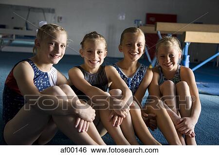 USA, Utah, Orem, Portrait of girls (8-11) resting in gym View Large Photo Image Stock Photograph - USA, Utah, Orem, Portrait of girls (8-11) resting in gym. Fotosearch