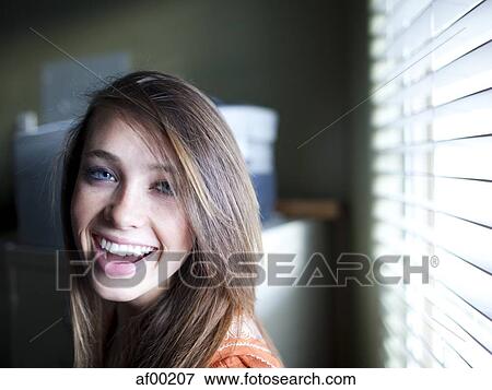 USA, Utah, Orem, Portrait of young woman laughing View Large Photo Image Stock Photo - USA, Utah, Orem, Portrait of young woman laughing. Fotosearch