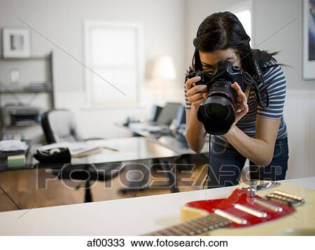 USA, Utah, Orem, Teenage girl (16-17) photographing guitar View Large Photo Image Stock Image - USA, Utah, Orem, Teenage girl (16-17) photographing guitar. Fotosearch