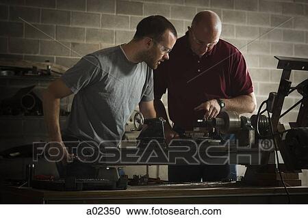 USA, Utah, Orem, two men working in workshop View Large Photo Image Stock Image - USA, Utah, Orem, two men working in workshop. Fotosearch