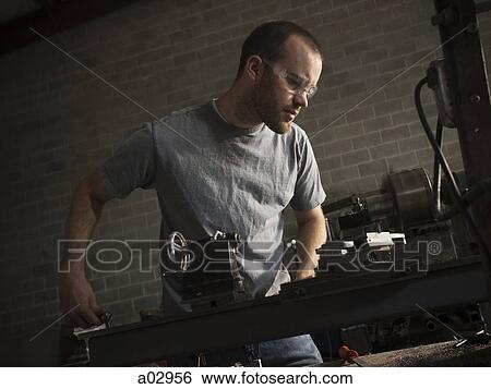 USA, Utah, Orem, young man doing metalwork View Large Photo Image Stock Photograph - USA, Utah, Orem, young man doing metalwork. Fotosearch