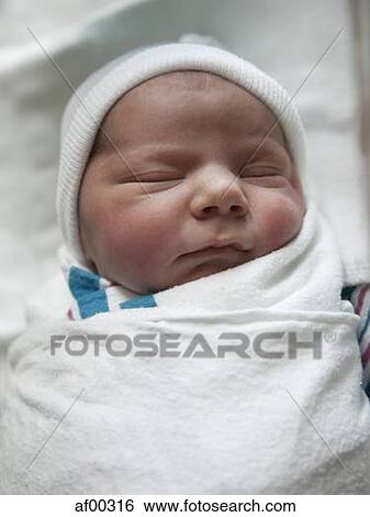 Stock Photograph - USA, Utah, Payson, Baby boy (0-1 months) in bed. Fotosearch