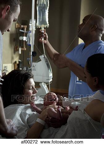 Stock Image - USA, Utah, Payson, Childbirth in hospital. Fotosearch