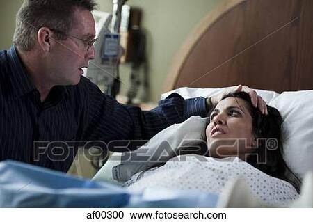 USA, Utah, Payson, Man assisting childbirth in hospital View Large Photo Image Stock Image - USA, Utah, Payson, Man assisting childbirth in hospital. Fotosearch