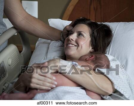 USA, Utah, Payson, Mother embracing baby boy (0-1 months) in bed View Large Photo Image Stock Image - USA, Utah, Payson, Mother embracing baby boy (0-1 months) in bed. Fotosearch