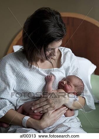 USA, Utah, Payson, Mother embracing baby boy (0-1 months) on bed View Large Photo Image Stock Image - USA, Utah, Payson, Mother embracing baby boy (0-1 months) on bed. Fotosearch