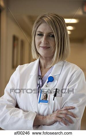 USA, Utah, Payson, Portrait of mature doctor smiling View Large Photo Image Stock Photograph - USA, Utah, Payson, Portrait of mature doctor smiling. Fotosearch