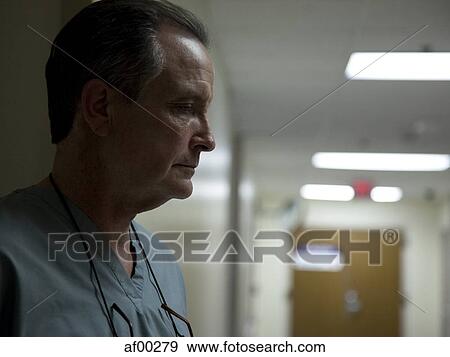 Stock Photo - USA, Utah, Payson, Portrait of contemplating doctor. Fotosearch