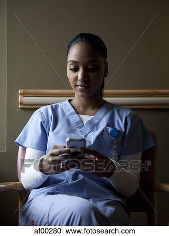USA, Utah, Payson, Young nurse sending text message View Large Photo Image Stock Image - USA, Utah, Payson, Young nurse sending text message. Fotosearch