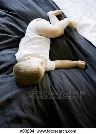 USA, Utah, Provo, Baby boy (18-23 months) asleep on bed View Large Photo Image Picture - USA, Utah, Provo, Baby boy (18-23 months) asleep on bed. Fotosearch